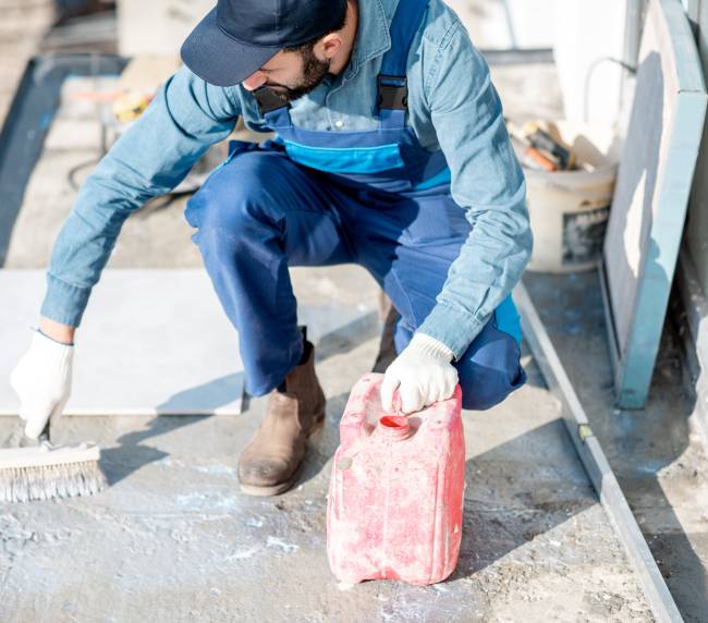 construction-worker-applying-primer-with-brush-on-2026-03-25-00-29-38-utc (1)