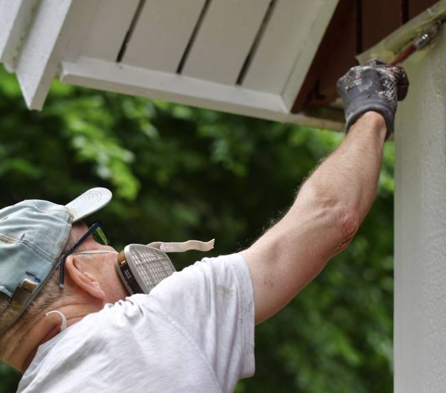 painter-applying-white-paint-on-wooden-building-2026-03-16-05-08-06-utc (1)