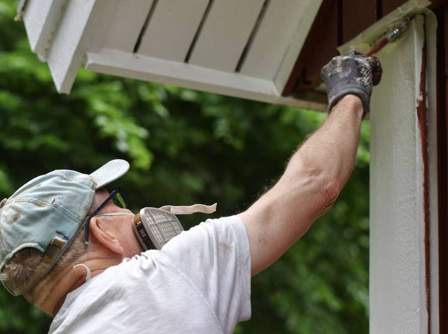 painter-applying-white-paint-on-wooden-building-2026-03-16-05-08-06-utc (1)