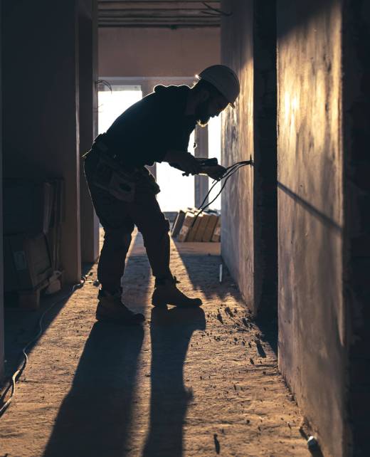 worker-is-cutting-wires-with-lineman-s-pliers